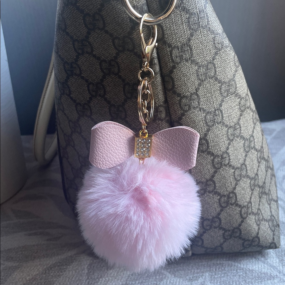 Pink fluffy charm with bow